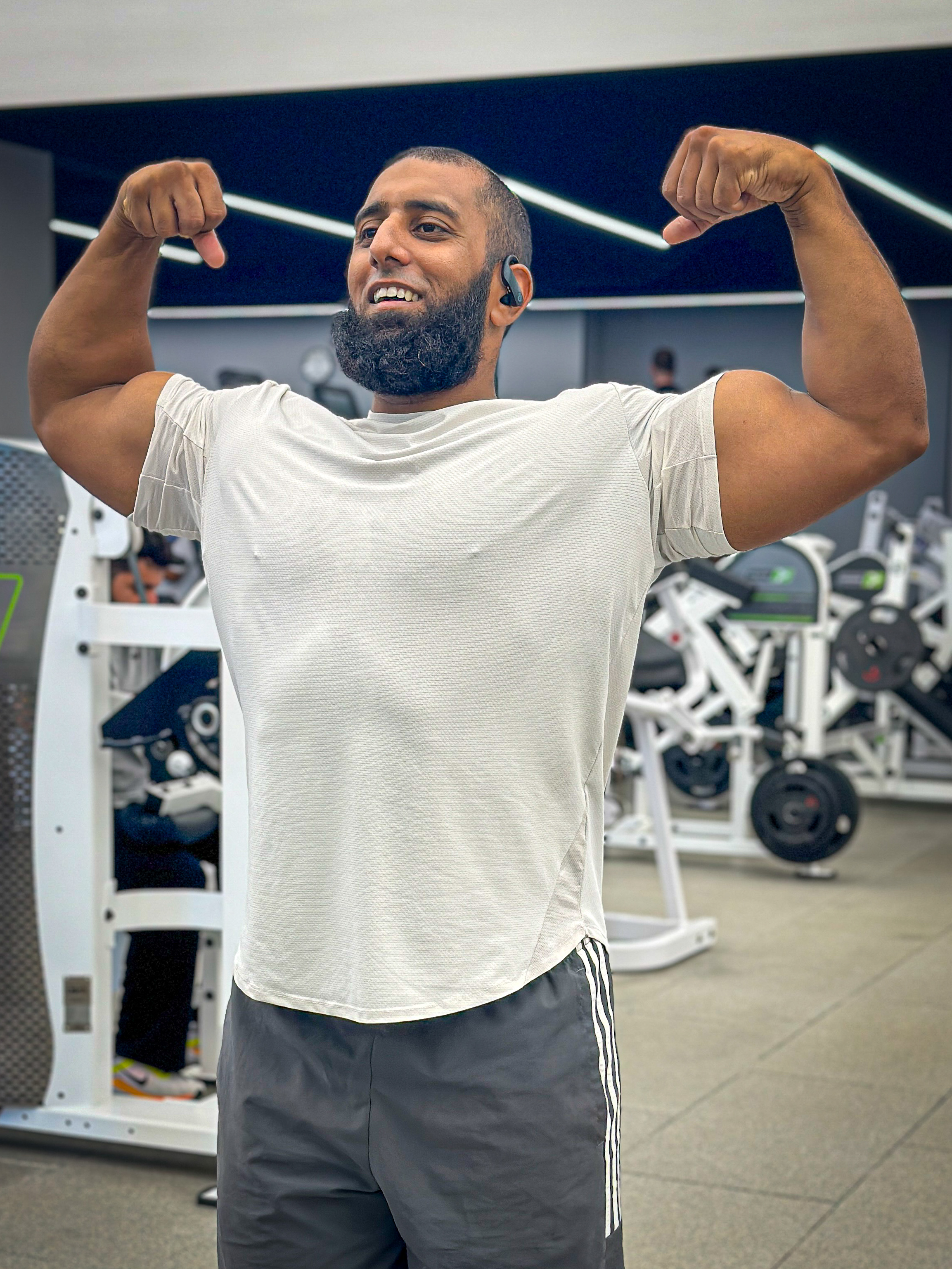 Gaff at the gym flexing and smiling